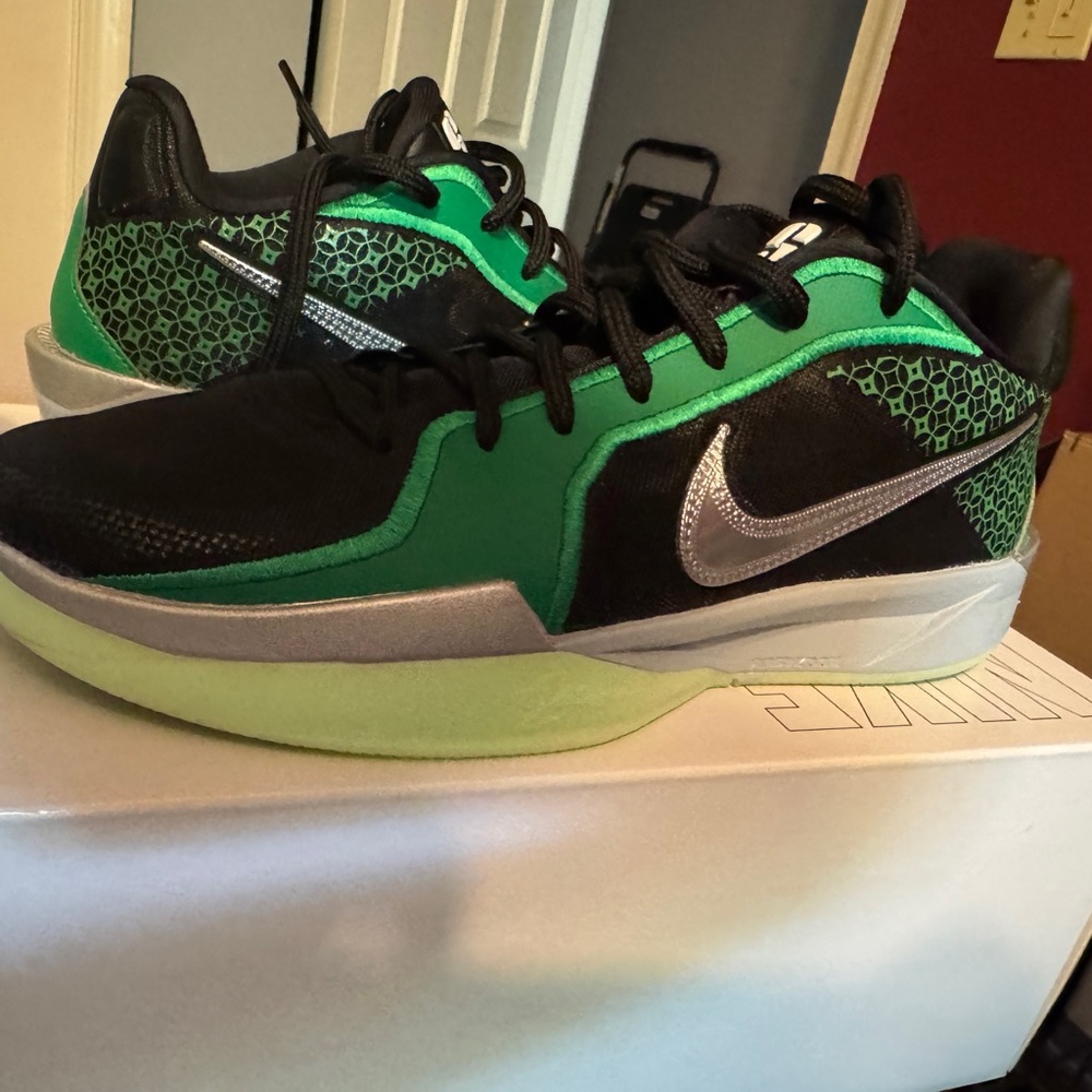 Nike Black and Green Athletic Shoes with Silver Accents